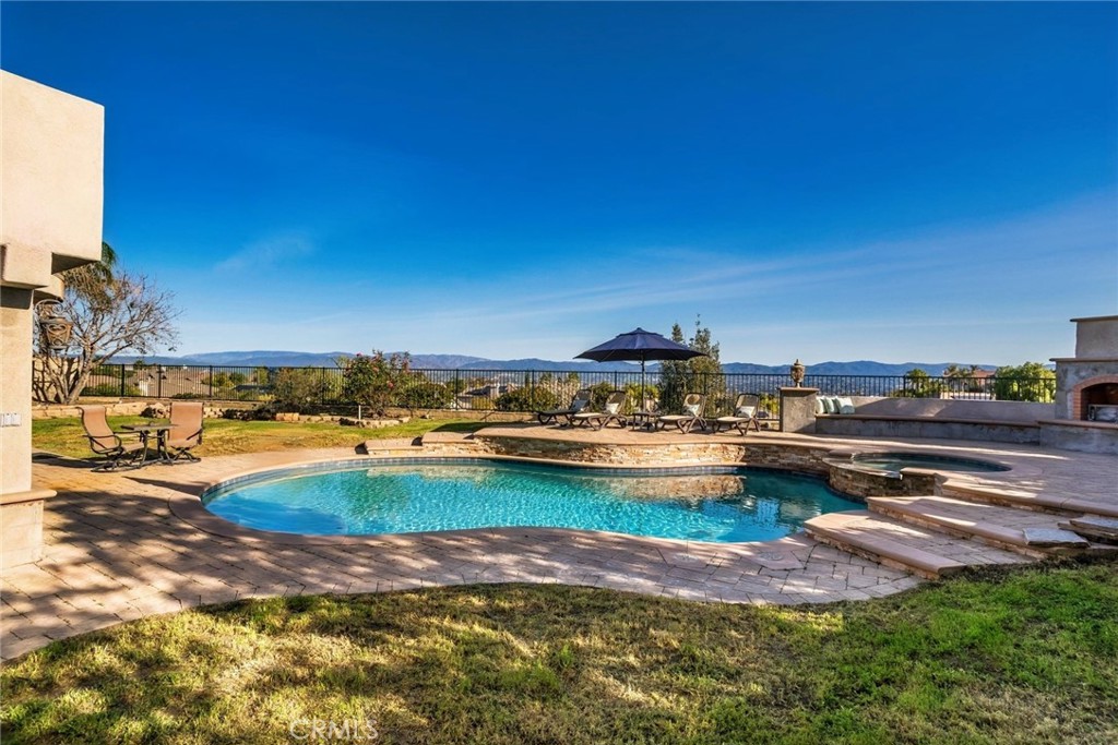 26403 Ocasey Place Stevenson Ranch, CA 91381 - Photo 10 of 27 a view of a lake with houses