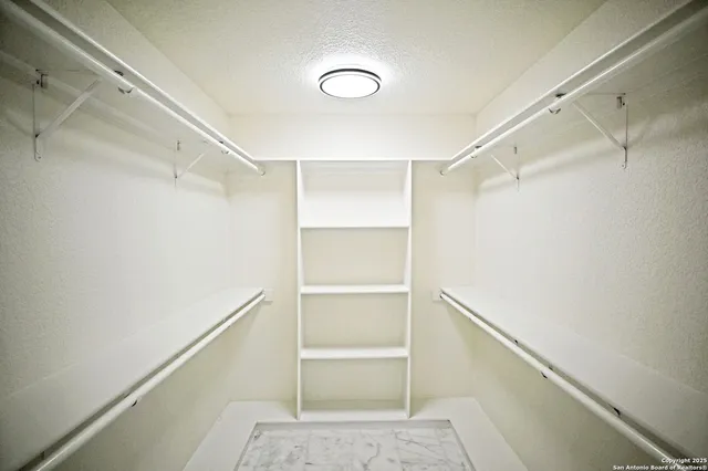 a view of an empty walk in closet