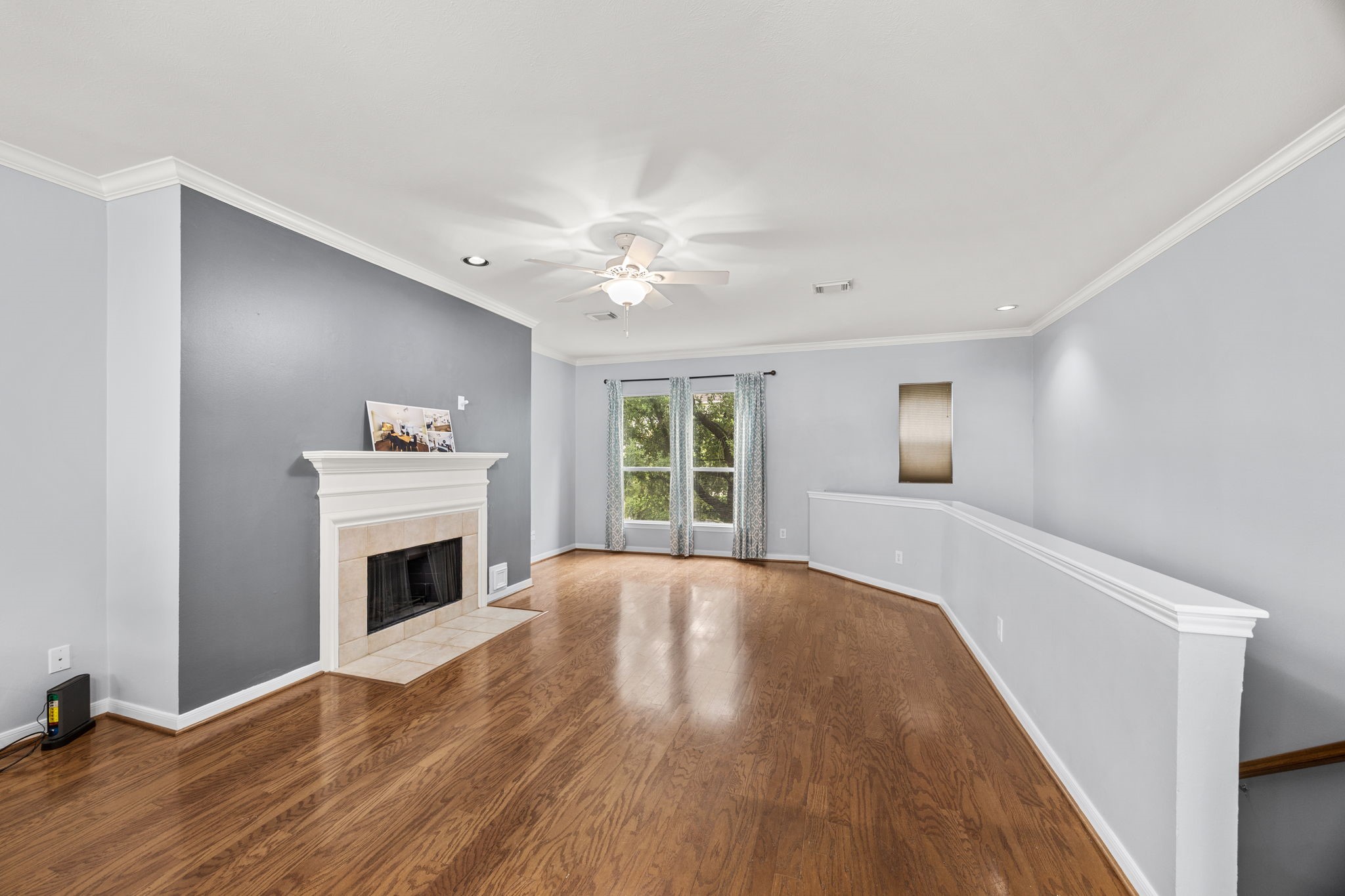 3023 Austin Street Houston, TX 77004 - Photo 9 of 26 2nd floor has wood flooring in living rm & dining rm, with fireplace
