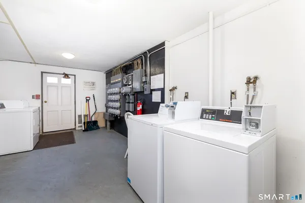 a view of storage and utility room with washer and dryer