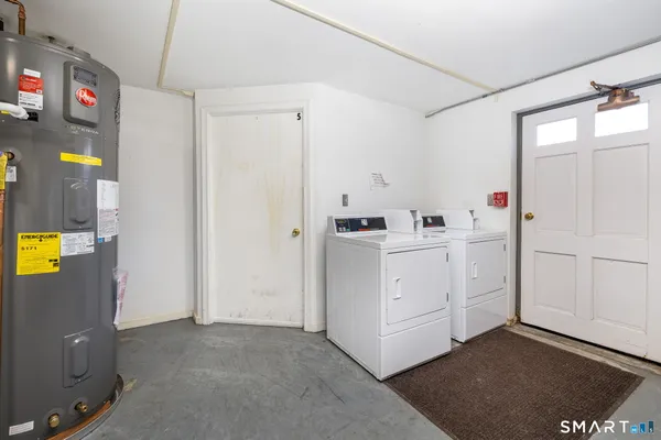 a view of cabinets and utility room