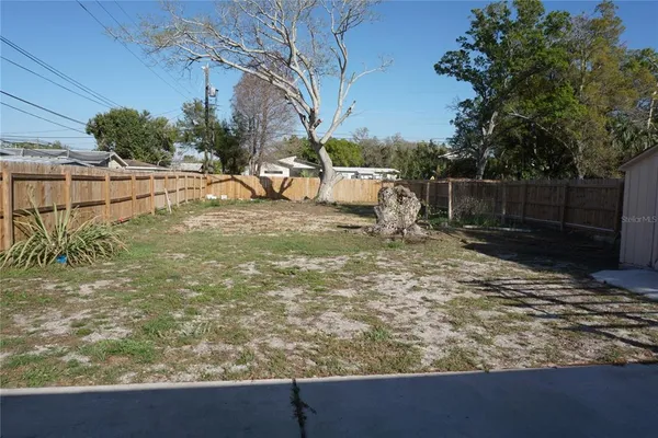 a view of a backyard of the house