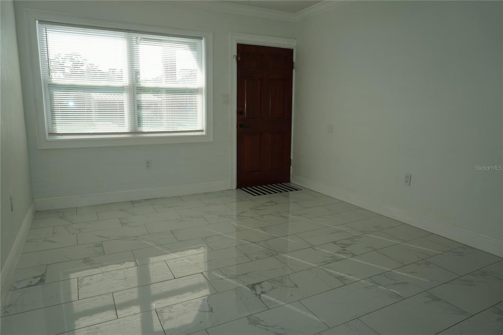 7173 63rd Street North Pinellas Park, FL 33781 - Photo 2 of 15 a view of an empty room with a window