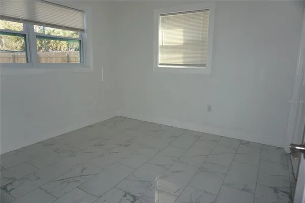 an empty room that has a window