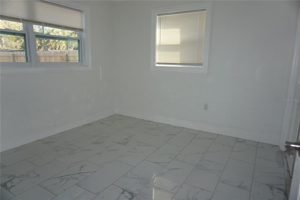 7173 63rd Street North Pinellas Park, FL 33781 - Photo 5 of 15 an empty room that has a window