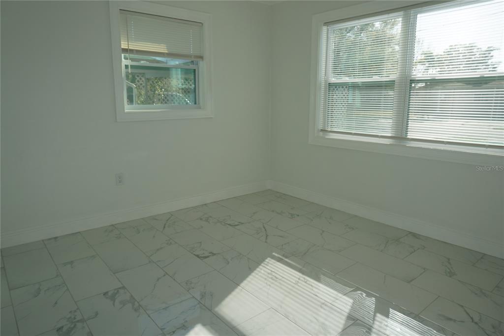 7173 63rd Street North Pinellas Park, FL 33781 - Photo 7 of 15 an empty room with a window