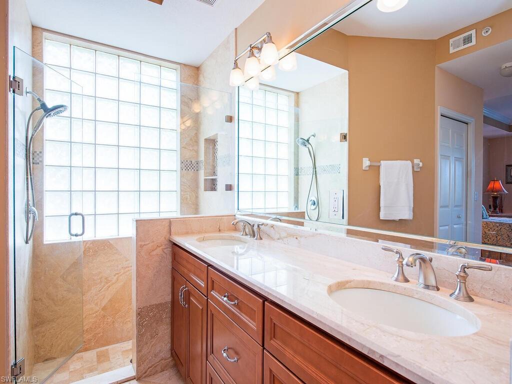 2285 Harmony Lane, Unit 104 Naples, FL 34109 - Photo 9 of 18 Owner's ensuite bath