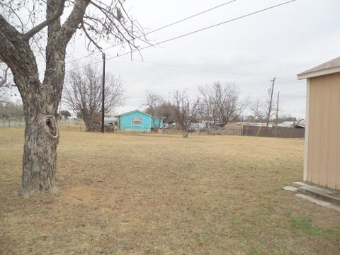 631 Ranck Avenue Mason, TX 76856 - Photo 14 of 17 a view of a yard with a tree