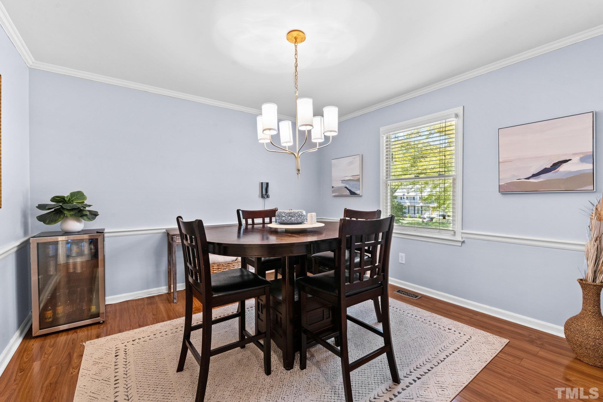 6704 Valley Drive Raleigh, NC 27612 - Photo 17 of 39 a view of a dining room with furniture and wooden floor