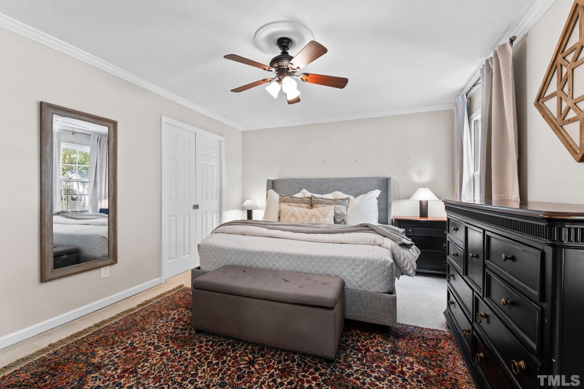 6704 Valley Drive Raleigh, NC 27612 - Photo 21 of 39 a bedroom with a bed and a window