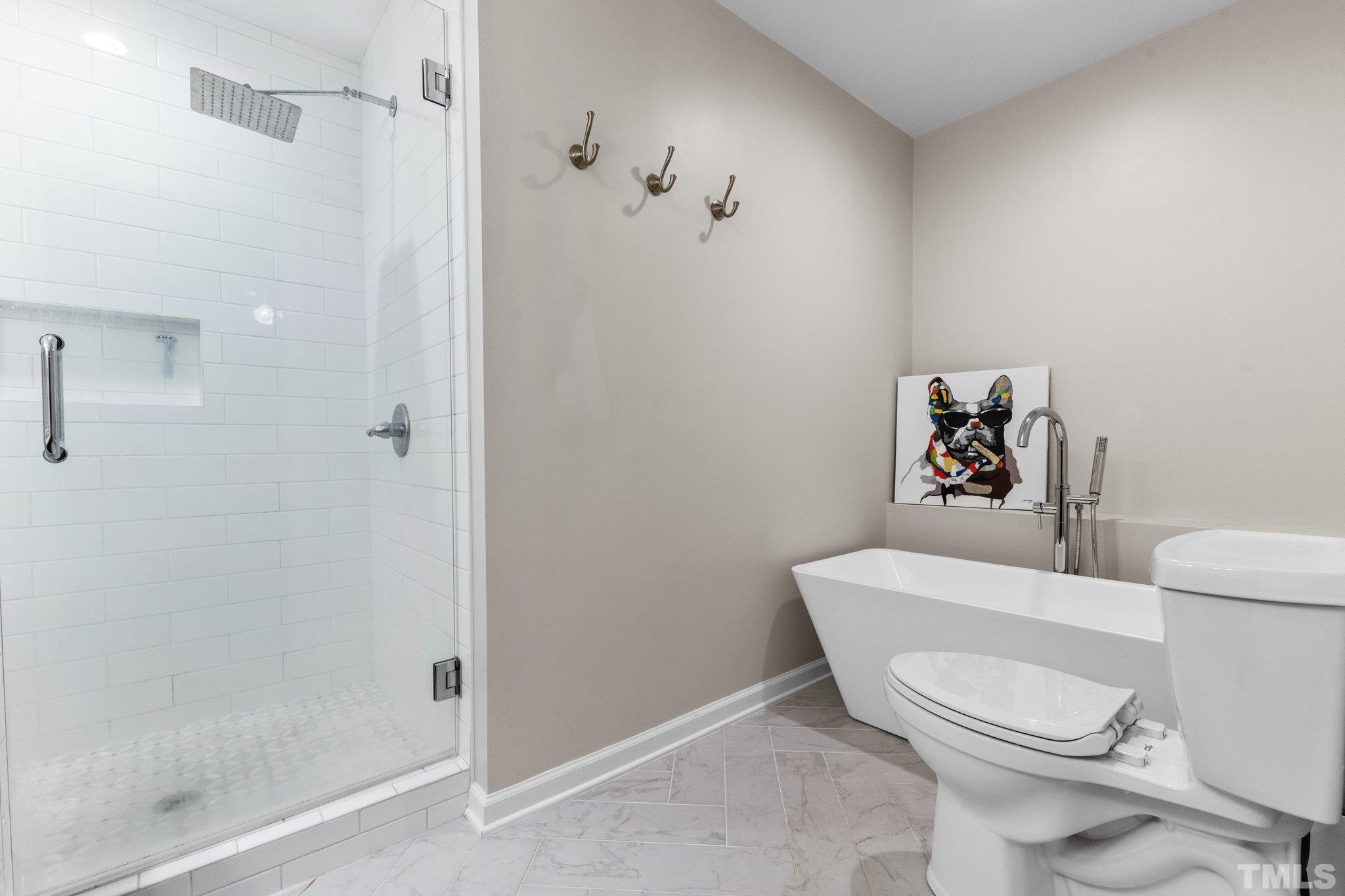 6704 Valley Drive Raleigh, NC 27612 - Photo 23 of 39 a white toilet sitting next to a bathroom sink