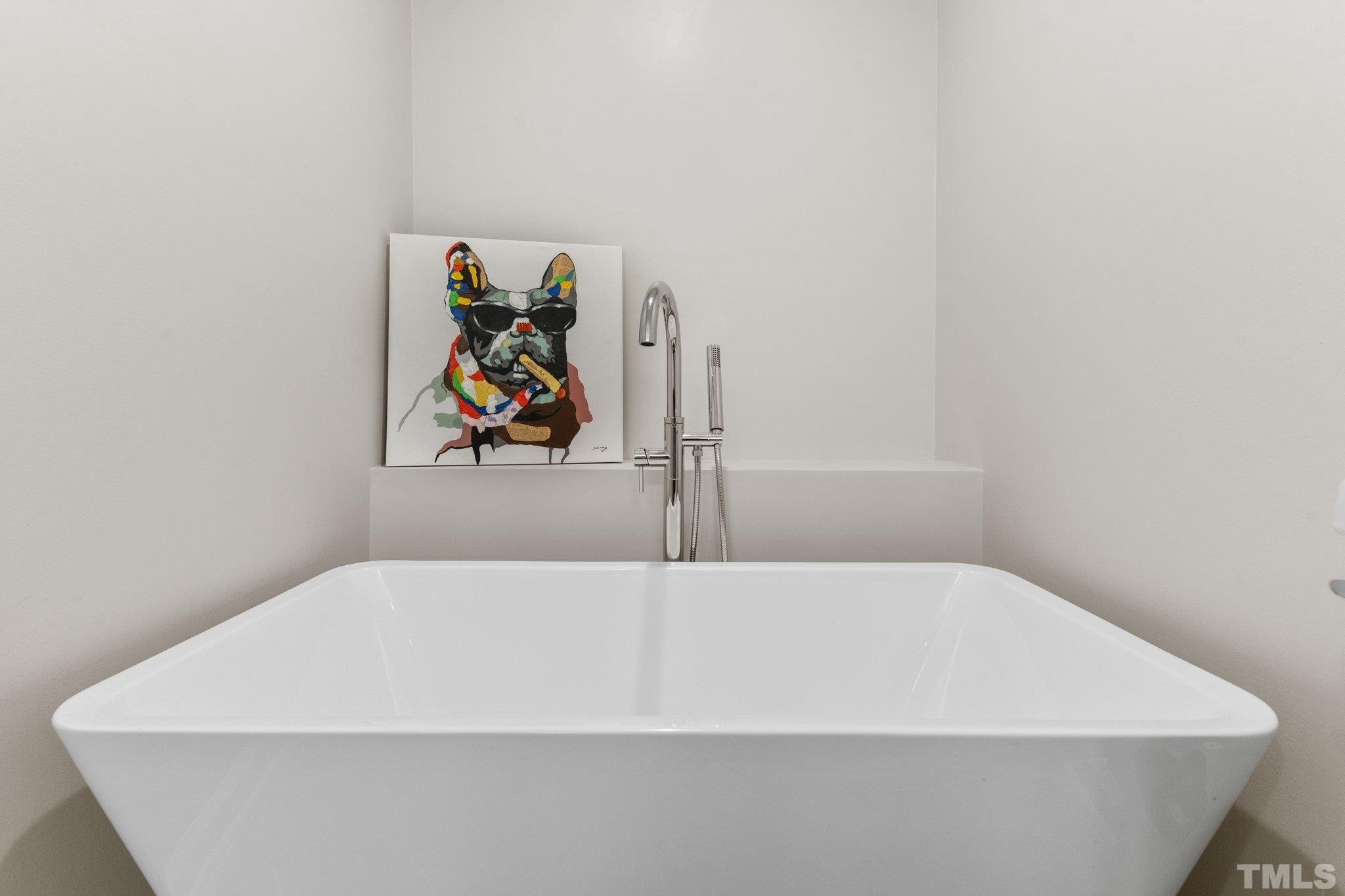 6704 Valley Drive Raleigh, NC 27612 - Photo 24 of 39 a white tub sitting next to a white wall