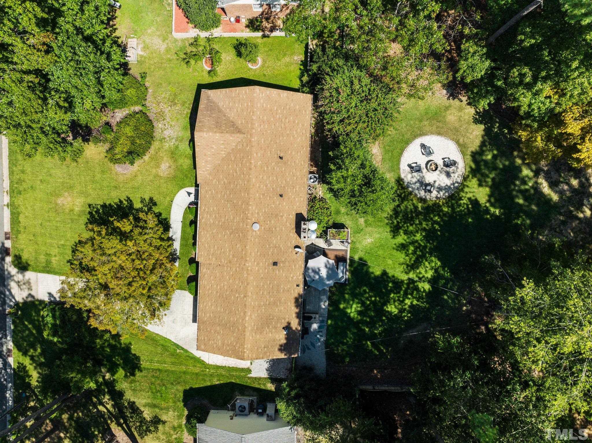 6704 Valley Drive Raleigh, NC 27612 - Photo 36 of 39 an aerial view of a house with a yard and garden view