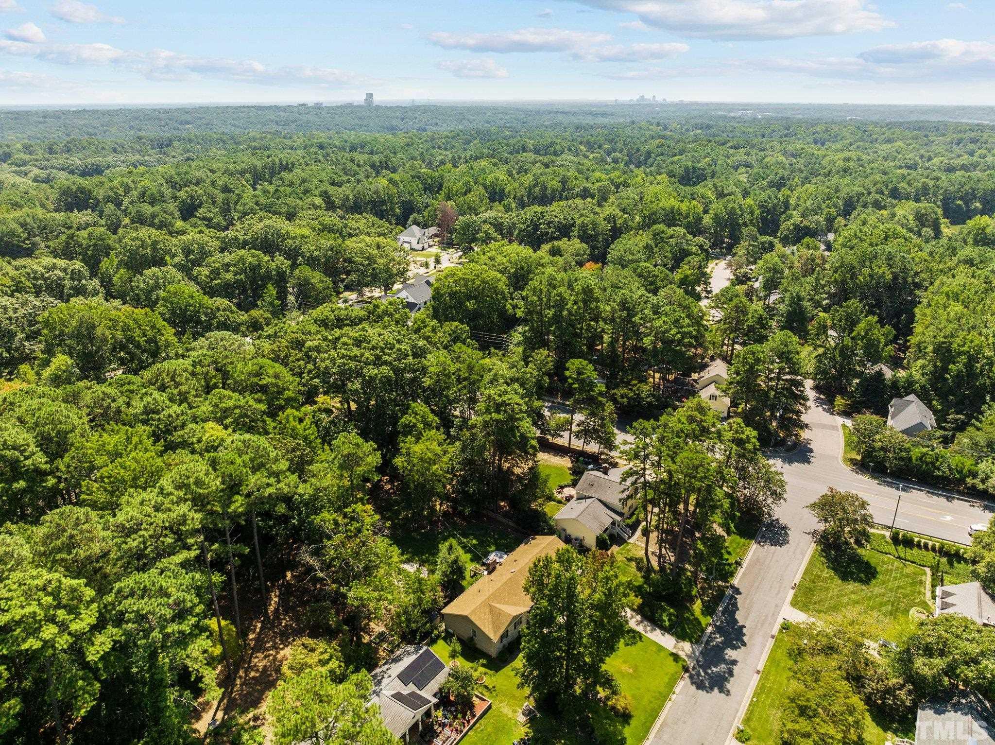 6704 Valley Drive Raleigh, NC 27612 - Photo 38 of 39 an aerial view of a city with lots of residential buildings
