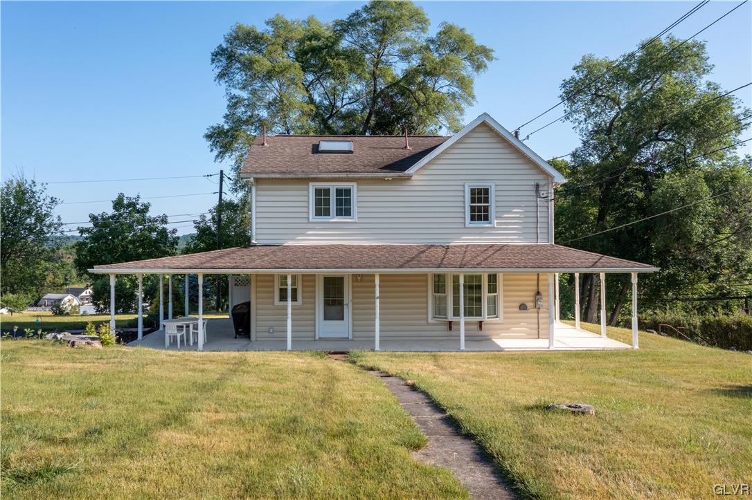 2174 Blue Barn Road Orefield, PA 18069 - Photo 1 of 23 a front view of a house with a yard table and chairs