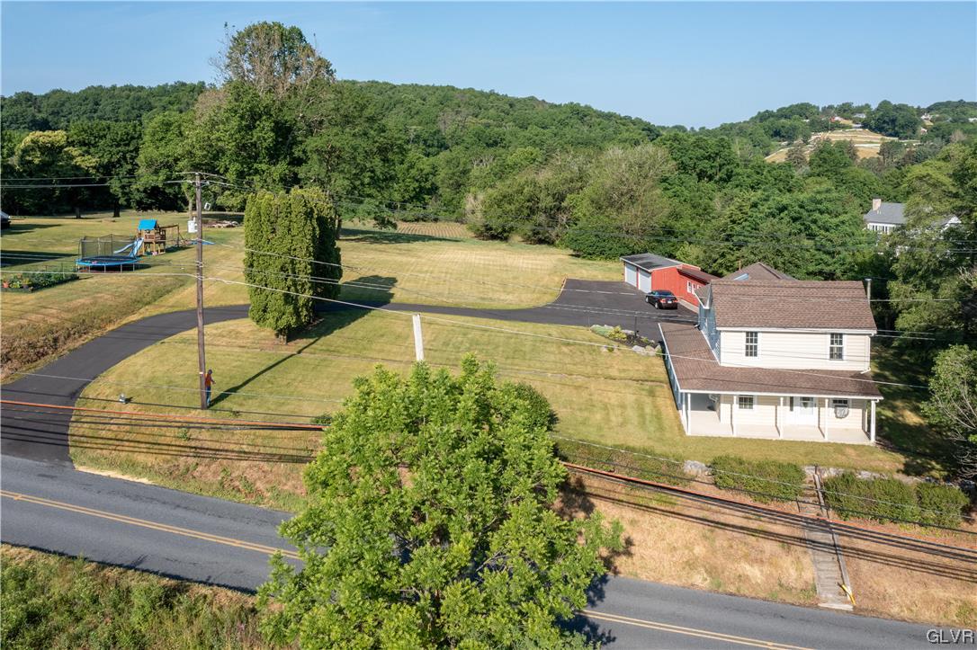 2174 Blue Barn Road Orefield, PA 18069 - Photo 21 of 23 a view of a house with a yard and a car park side of a street