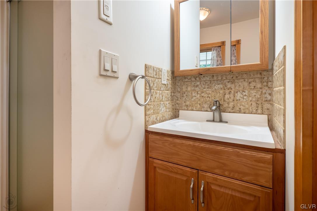 2174 Blue Barn Road Orefield, PA 18069 - Photo 9 of 23 a bathroom with a sink and a mirror