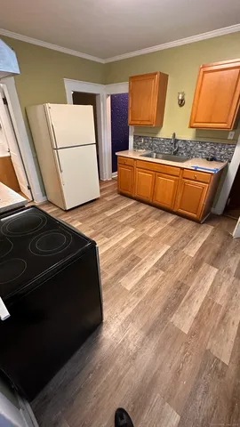 a living room with a couch and a stove