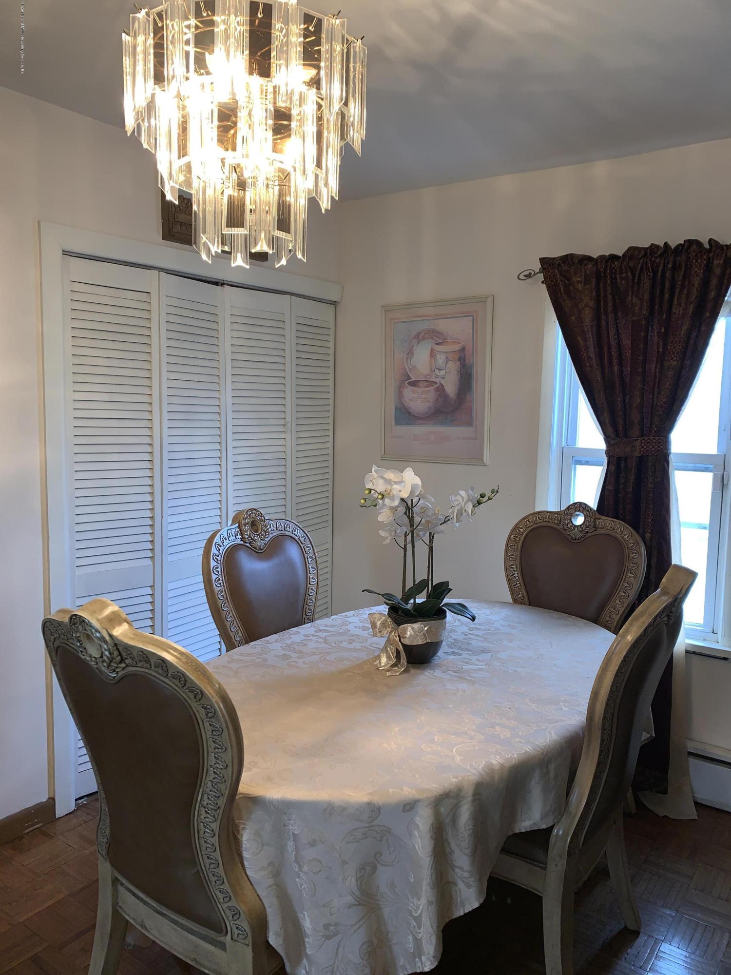 7 Lockman Place Staten Island, NY 10303 - Photo 12 of 41 a dining room with furniture and chandelier