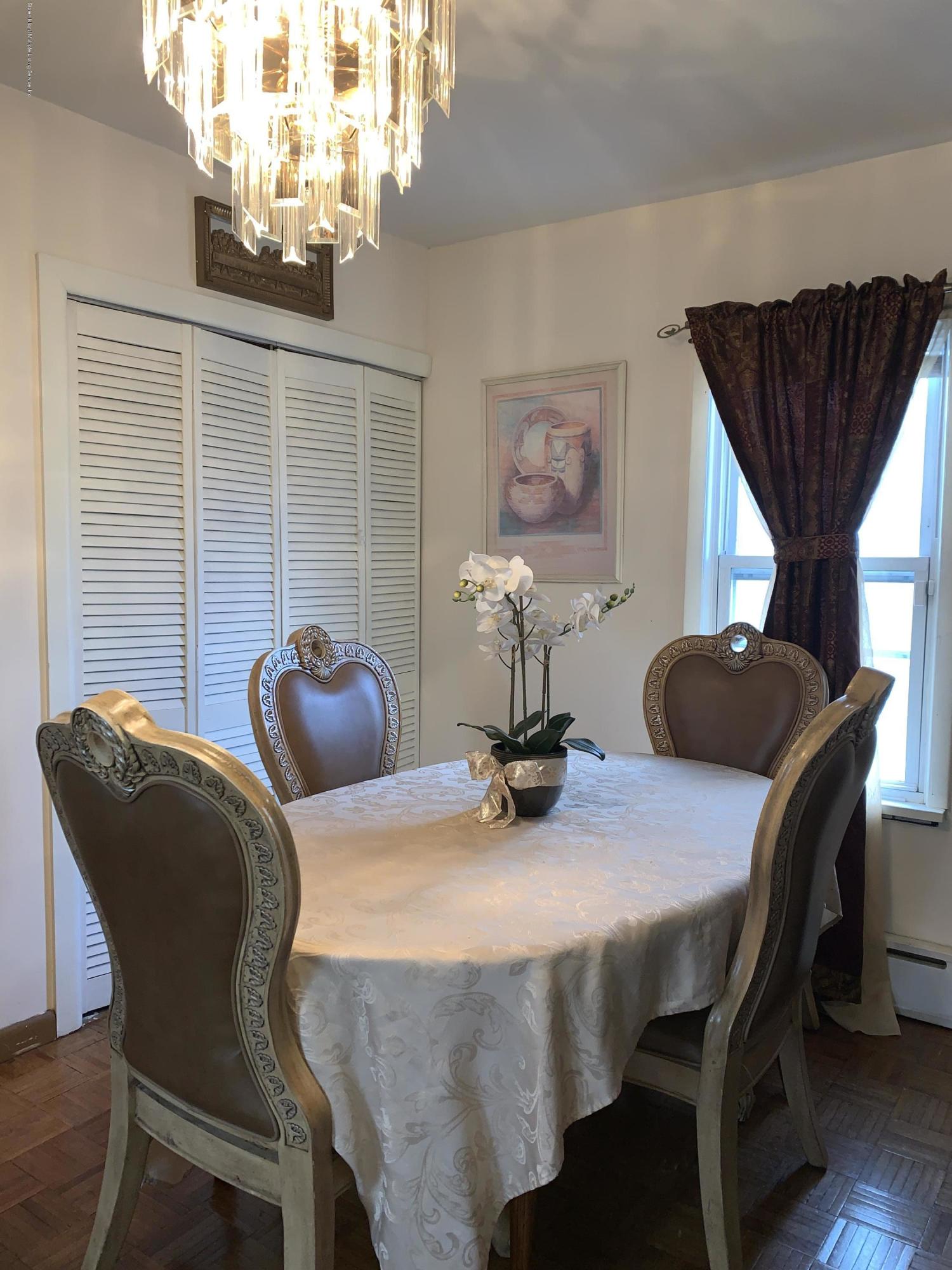 7 Lockman Place Staten Island, NY 10303 - Photo 13 of 41 a dining room with furniture and window