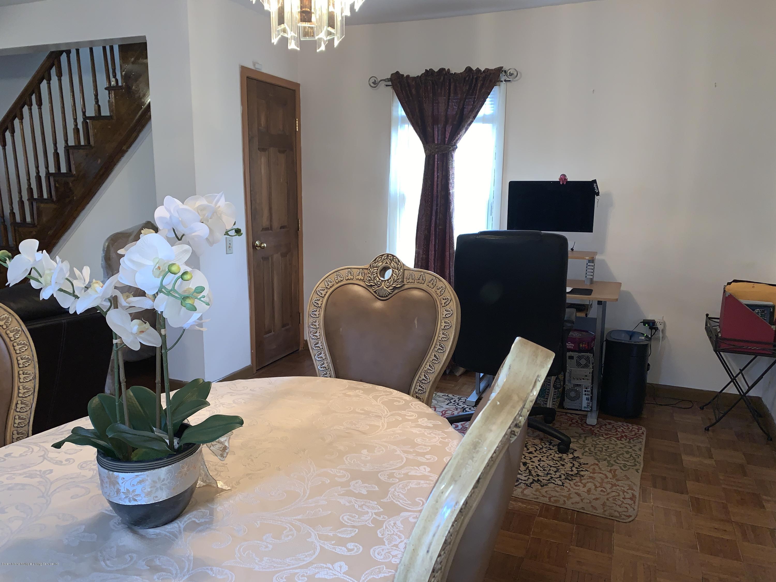 7 Lockman Place Staten Island, NY 10303 - Photo 16 of 41 a living room with furniture flowerpot and wooden floor