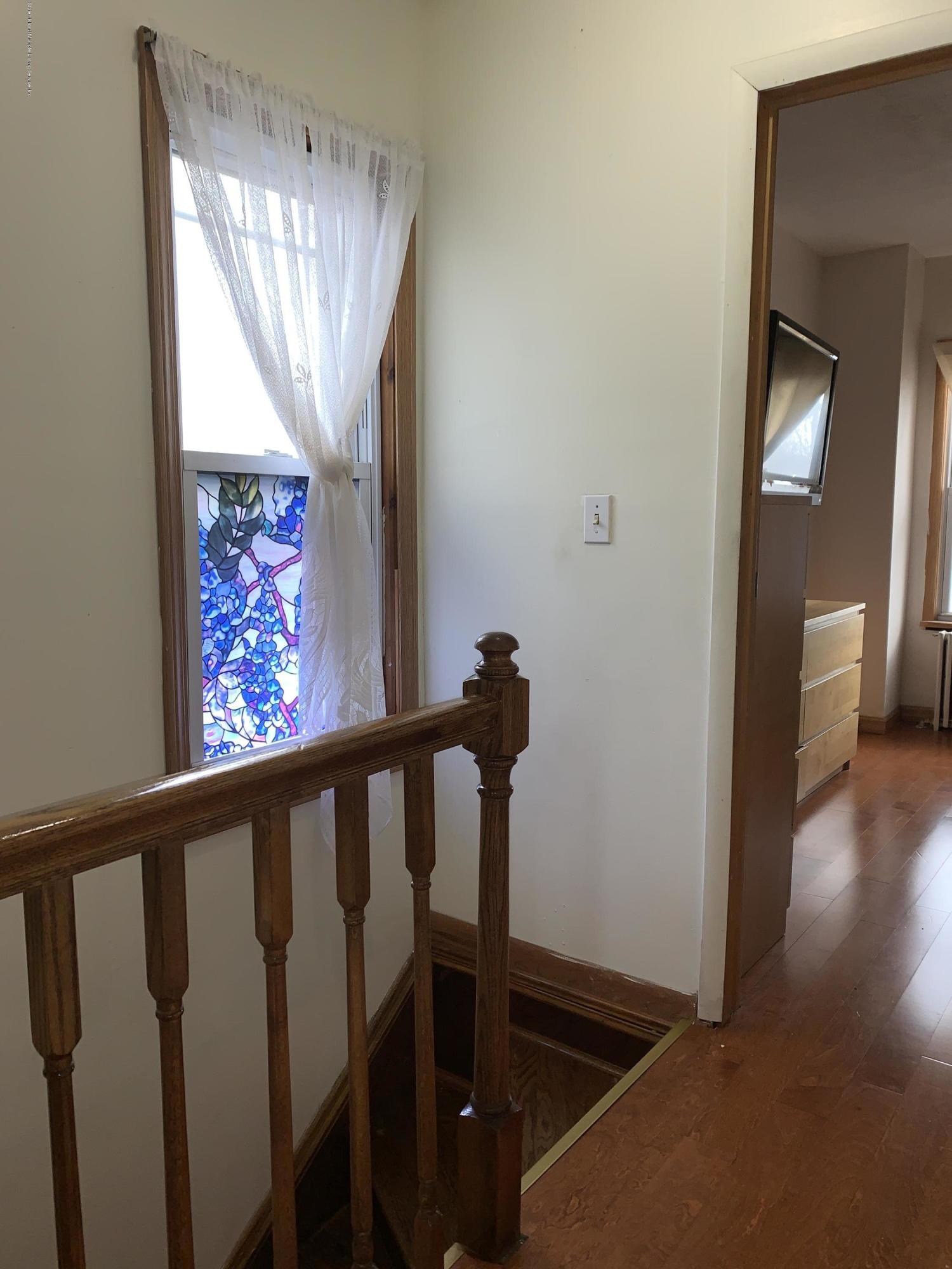 7 Lockman Place Staten Island, NY 10303 - Photo 19 of 41 a view of entryway and hall with wooden floor