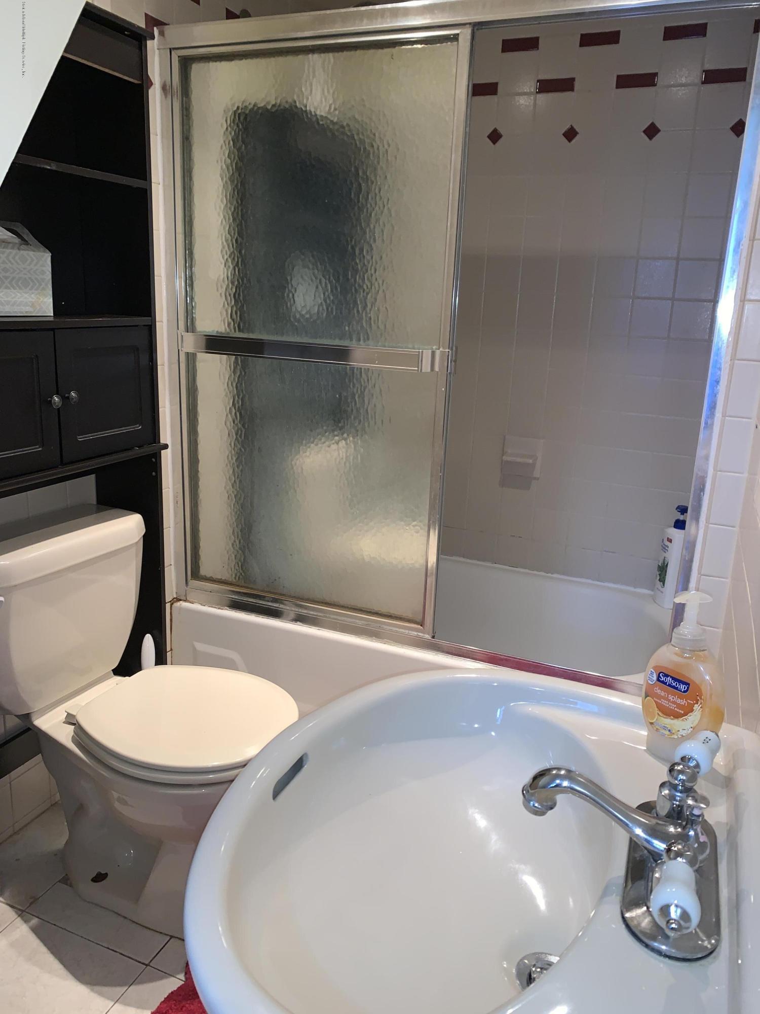 7 Lockman Place Staten Island, NY 10303 - Photo 26 of 41 a bathroom with a sink toilet and shower
