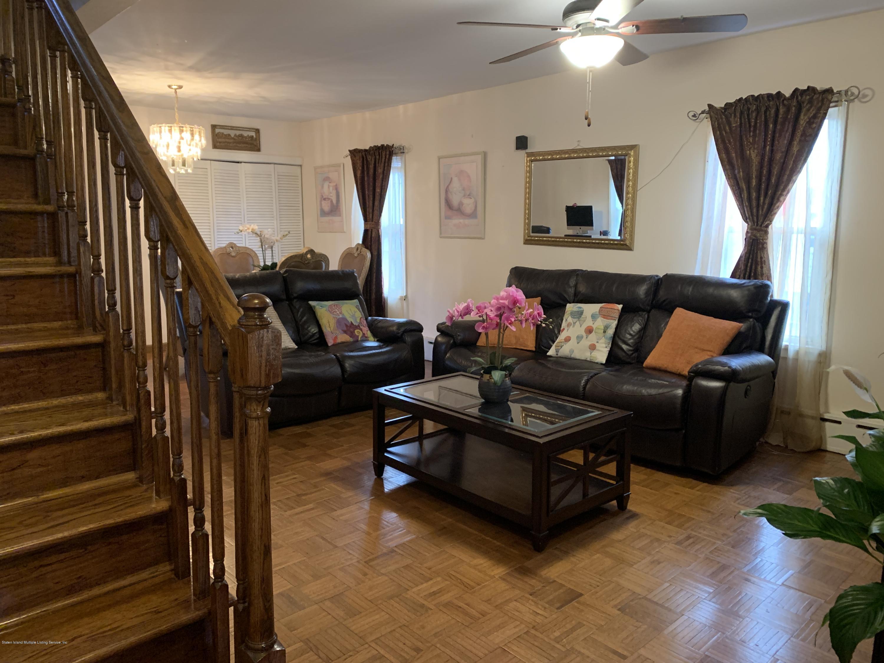 7 Lockman Place Staten Island, NY 10303 - Photo 32 of 41 a living room with furniture and wooden floor