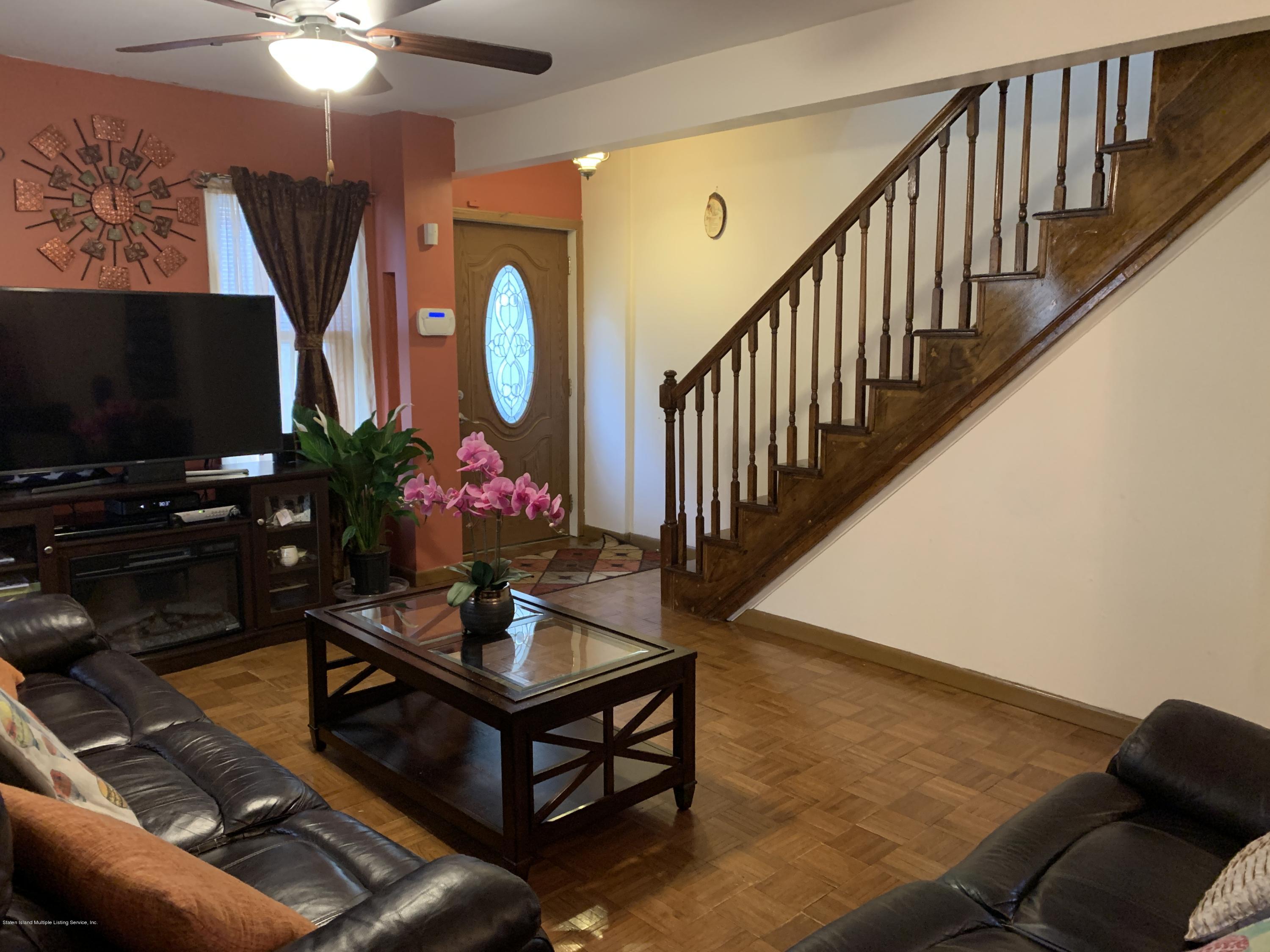 7 Lockman Place Staten Island, NY 10303 - Photo 34 of 41 a living room with furniture fireplace and flat screen tv