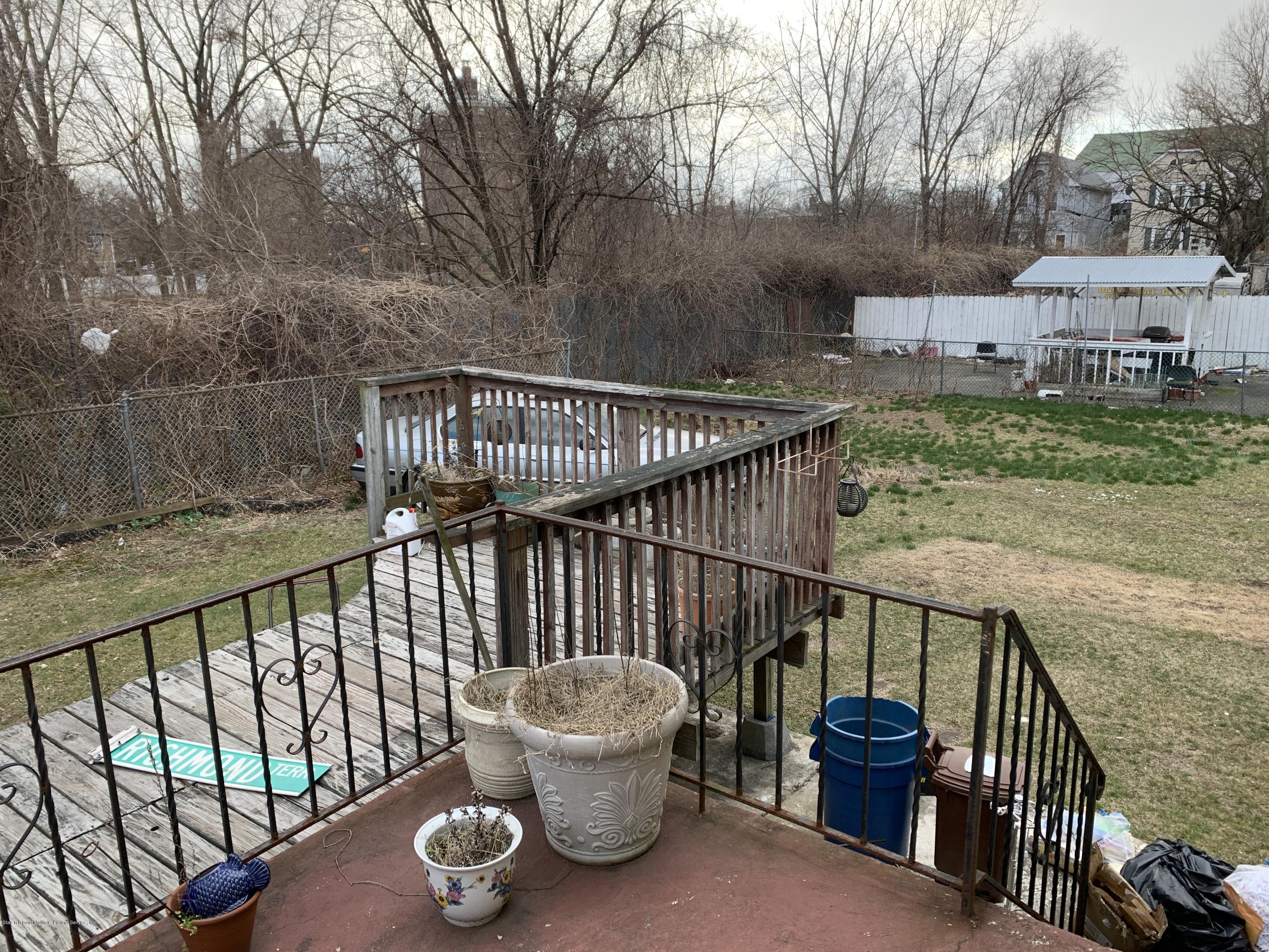 7 Lockman Place Staten Island, NY 10303 - Photo 37 of 41 a view of a chair and table on the balcony