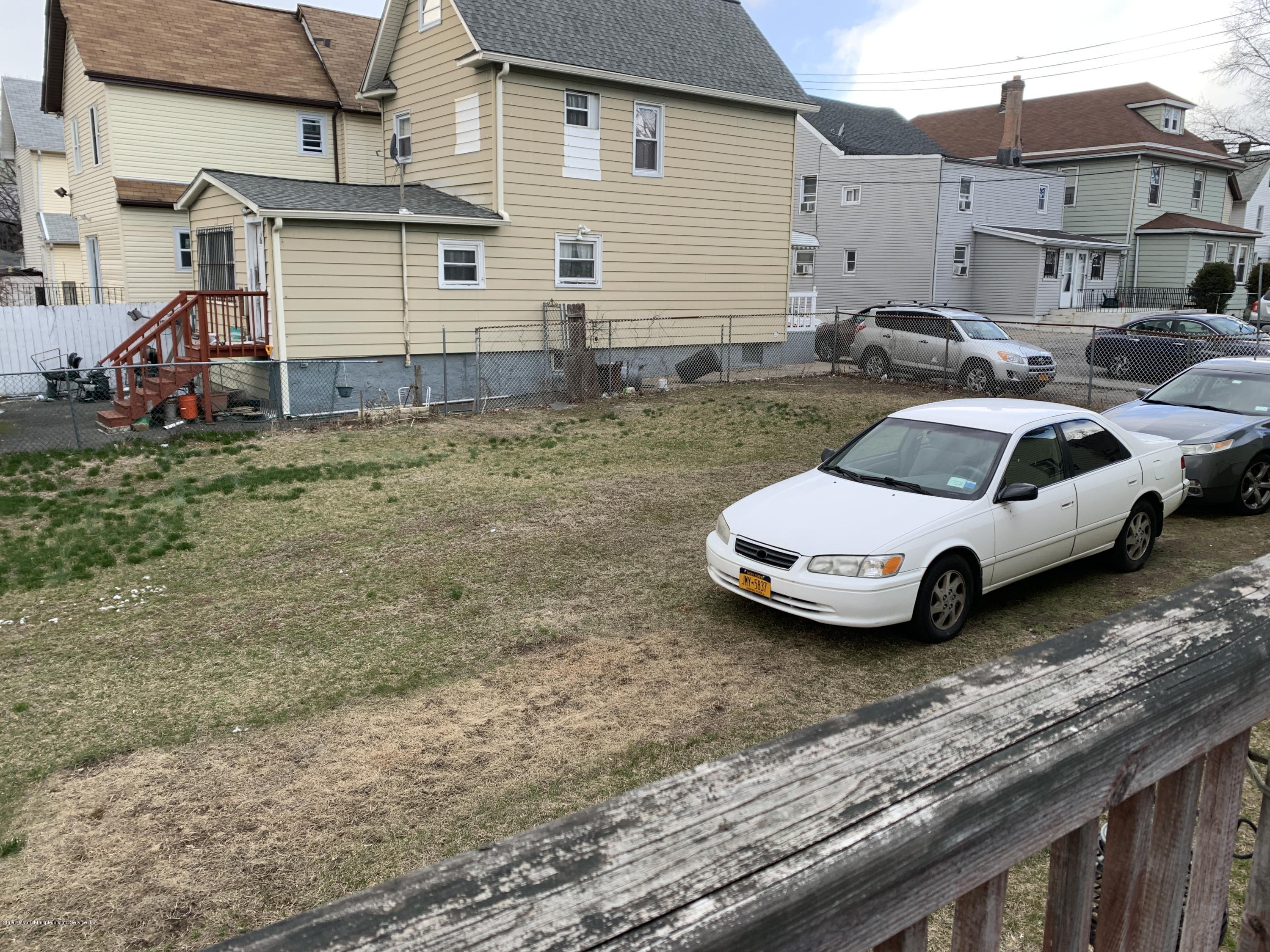 7 Lockman Place Staten Island, NY 10303 - Photo 40 of 41 a view of a car parked in front of a house