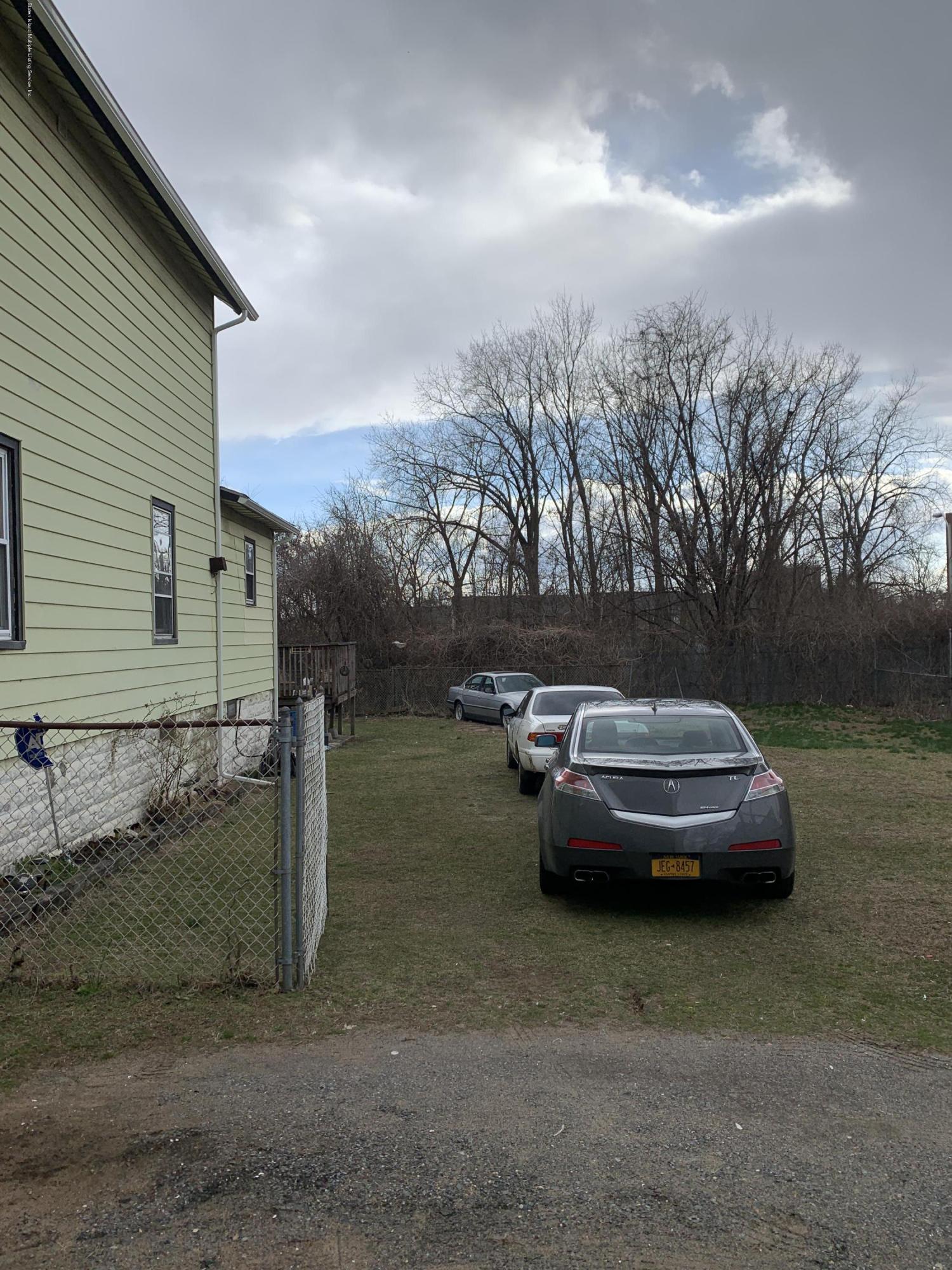 7 Lockman Place Staten Island, NY 10303 - Photo 5 of 41 a view of a house with a yard and sitting area