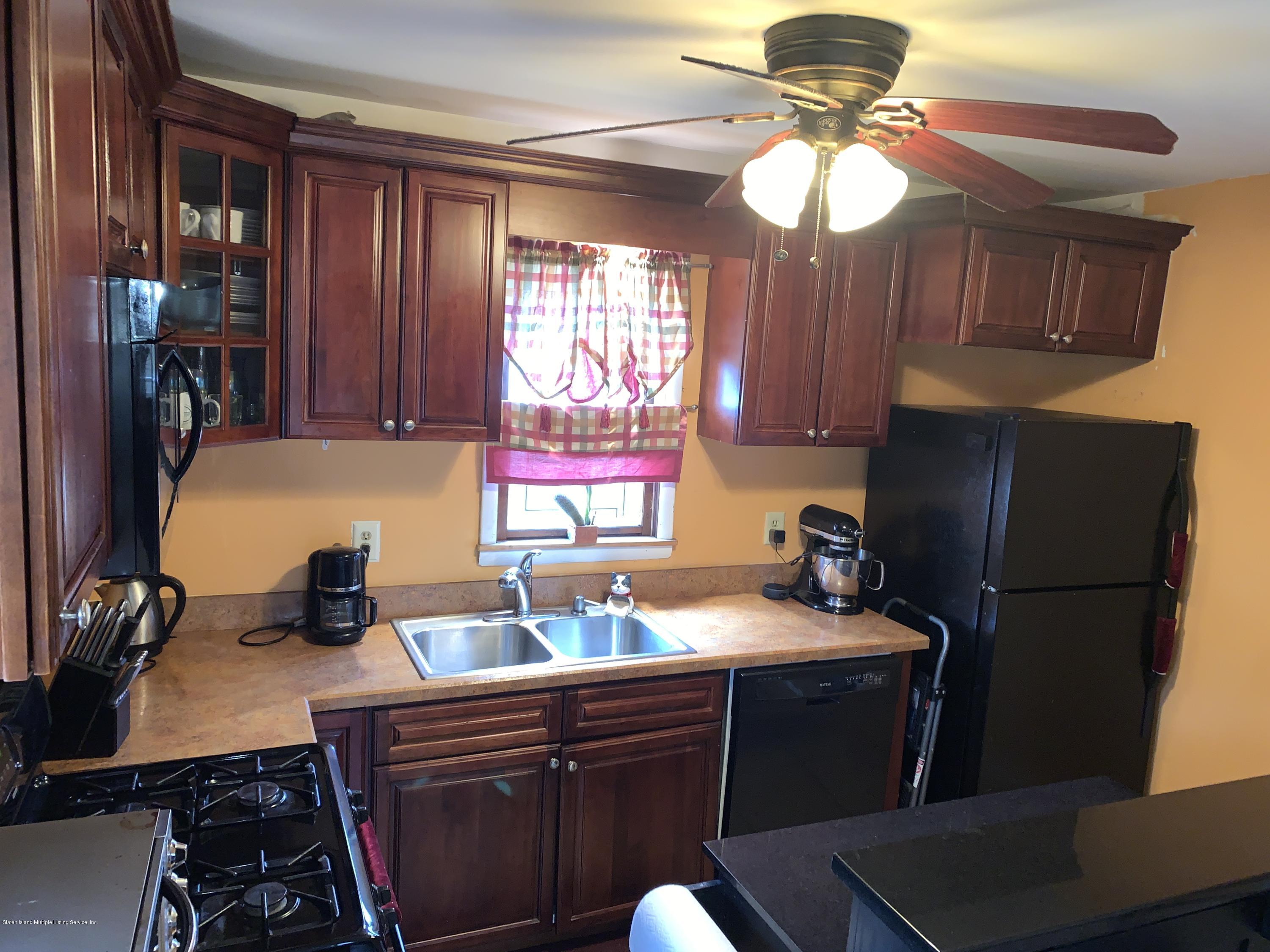 7 Lockman Place Staten Island, NY 10303 - Photo 7 of 41 a kitchen with a refrigerator and a sink