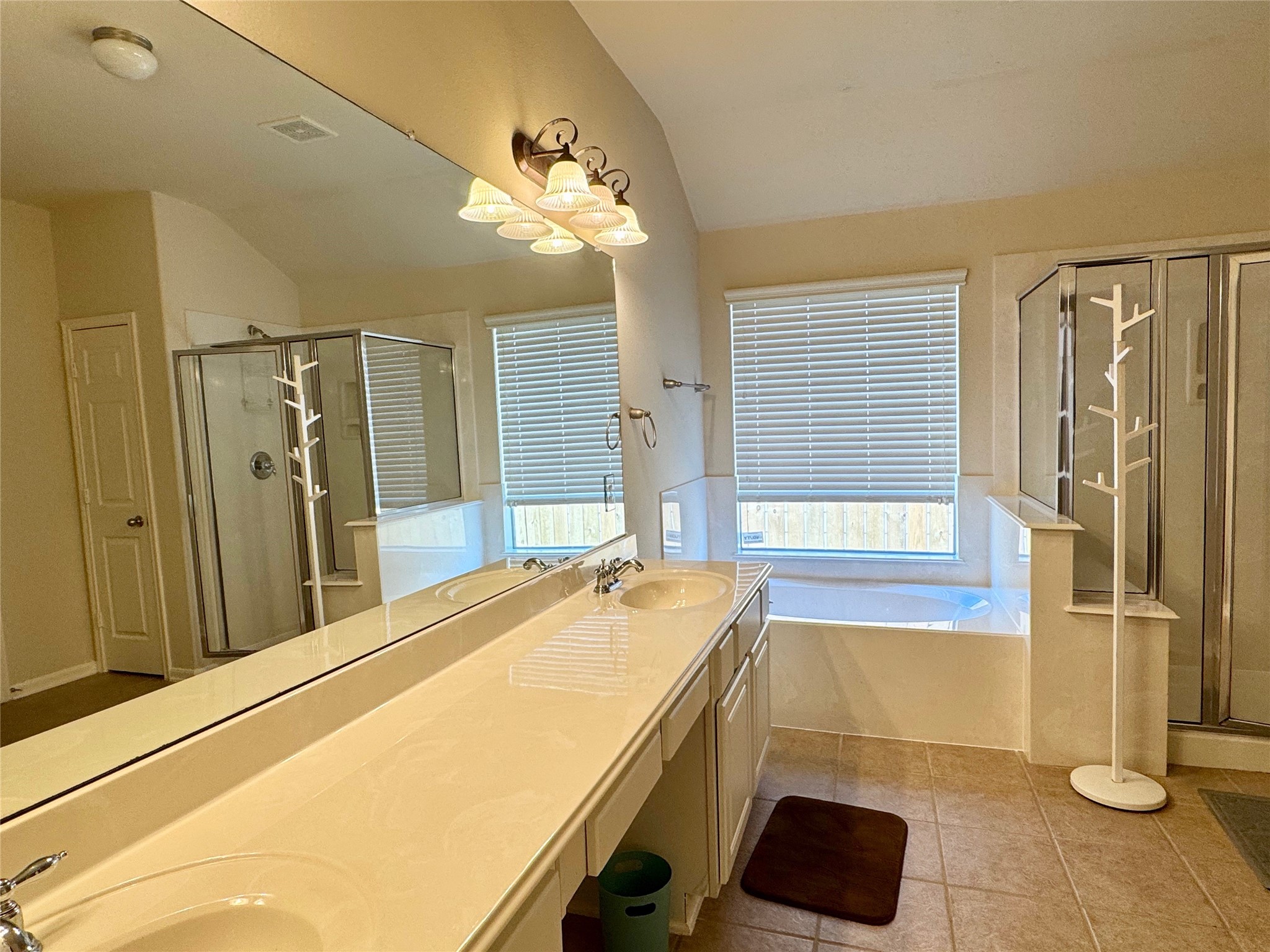 21818 Saragosa Pond Lane Spring, TX 77379 - Photo 12 of 15 The primary bath has a separate shower, garden tub, double sinks and a vanity. There is also a large closet.
