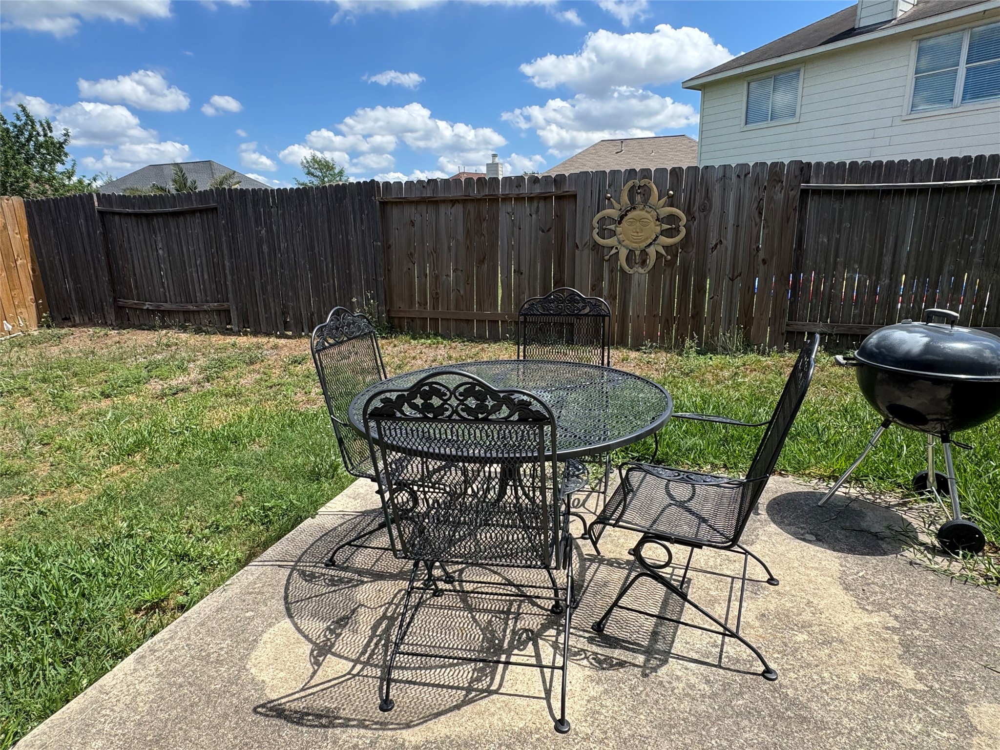 21818 Saragosa Pond Lane Spring, TX 77379 - Photo 15 of 15 The backyard is fully fenced and has a patio. Yard service is included.