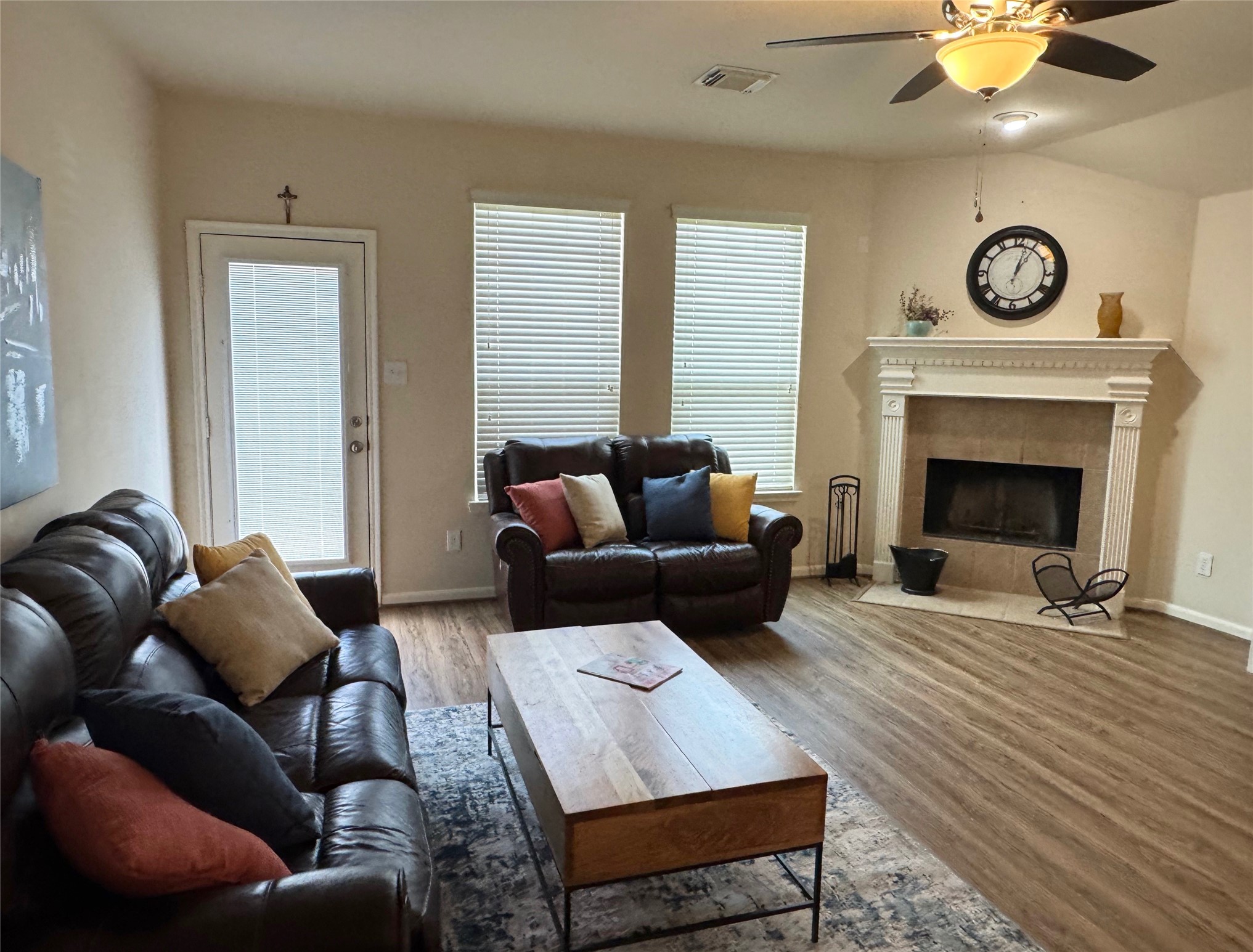 21818 Saragosa Pond Lane Spring, TX 77379 - Photo 4 of 15 The family room includes a fireplace and 2 recliners and is open to the kitchen.