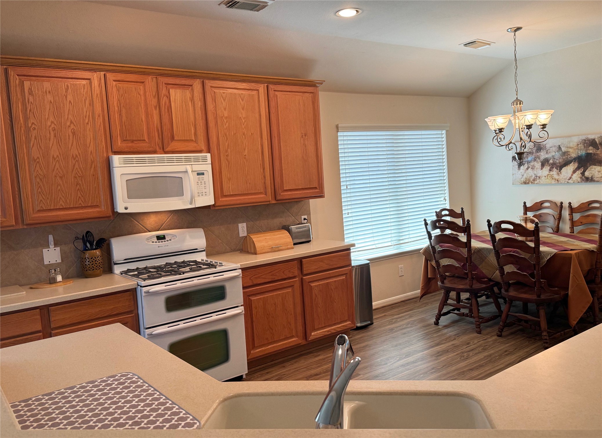 21818 Saragosa Pond Lane Spring, TX 77379 - Photo 9 of 15 The kitchen is stocked with all the pots, pans, utensils, and gadgets that you will need.