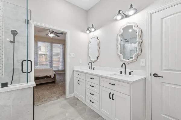 a spacious bedroom with a bed and a cabinets