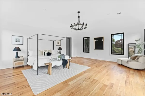 a view of a livingroom with furniture window and wooden floor
