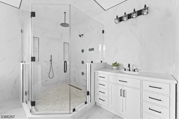 a bathroom with a bathtub and a sink