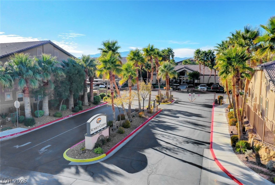 8985 South Durango Drive, Unit 2187 Las Vegas, NV 89113 - Photo 38 of 73 Enter through a secured gate into this serene community framed by abundant palm trees and mountain views.