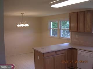 83 New Road Pedricktown, NJ 08067 - Photo 4 of 5 a kitchen with a sink and chandelier