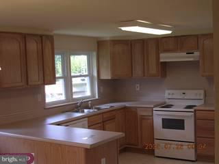 83 New Road Pedricktown, NJ 08067 - Photo 5 of 5 a kitchen that has a sink and a stove in it