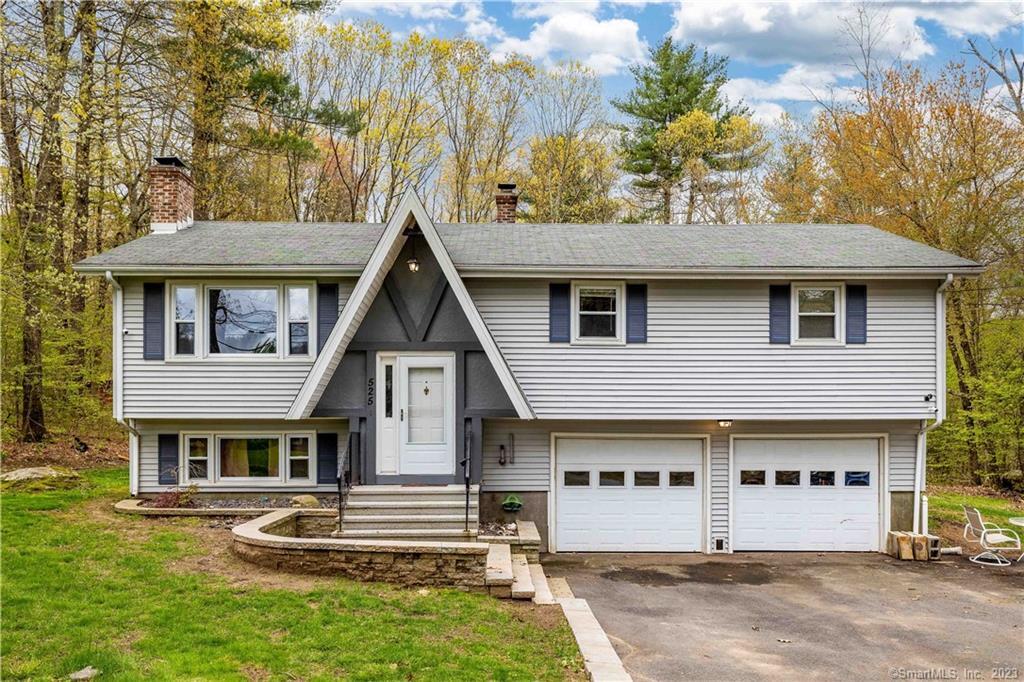 525 Buff Cap Road Tolland, CT 06084 - Photo 1 of 1 a front view of a house with a yard