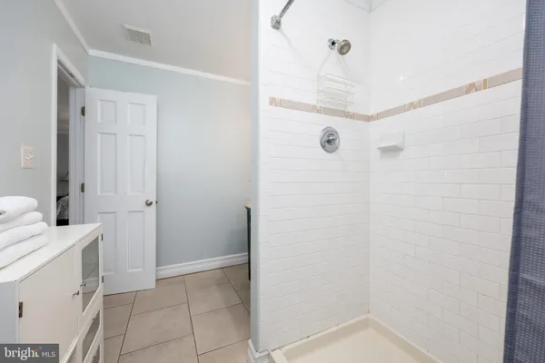 a bathroom with a sink and shower