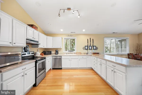 a large kitchen with cabinets