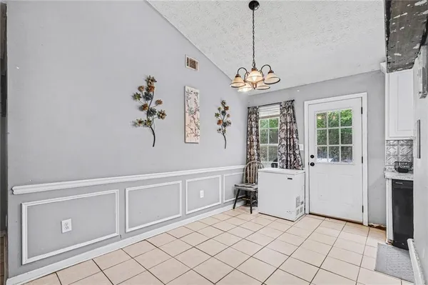 a view of an entryway with chandelier