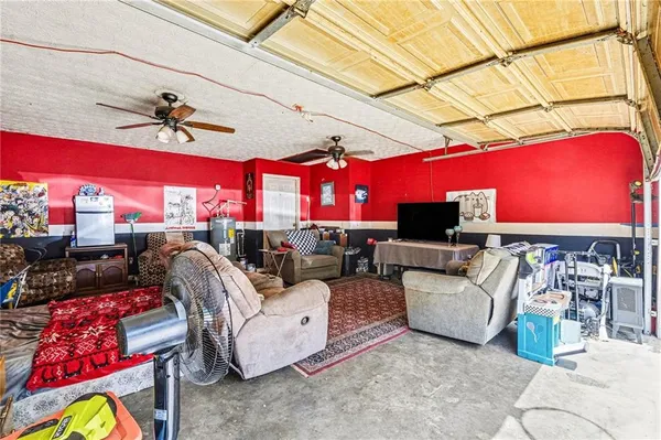 a living room with furniture a rug and a chandelier