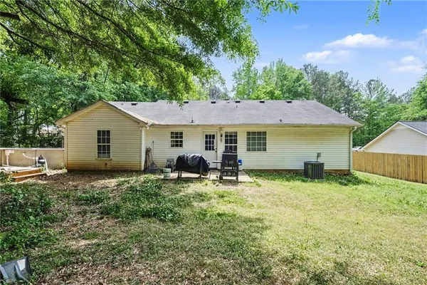 a house that has tree in front of it