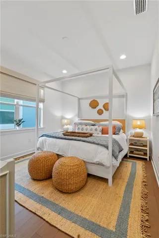 a bedroom with bed and window